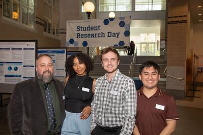 four YC&E Staff at an event. Smiling.