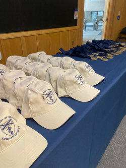 hats lined up on registration table 