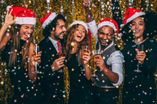 5 people celebrating the holidays with champagne