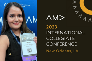 Daniela holding up judging badge 