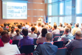 Rows of employees watching a presentation