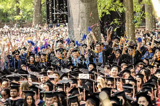 Yale graduates celebrating graduation on Old Campus 