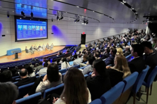 Back of room picture of a full Evans Hall in Yale School of Management 