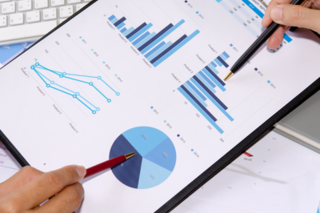 Spreadsheet with pie graph, line graph, and bar graphs.