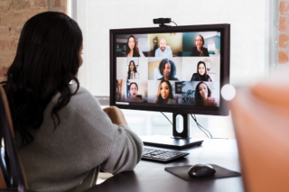 Women sitting at computing on a meeting 