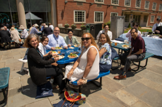 Yale reunion members seated at benches