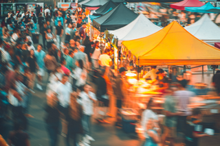 Ariel view of busy pedestrian street with vendor tents set up