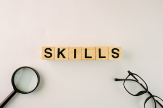 scrabble blocks spelling out the word "skills"