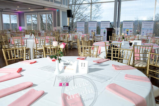 image of room and table set ups with pink napkins 