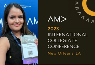 Daniela holding up judging badge