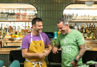 Owners of restaurant pictured in front of bar