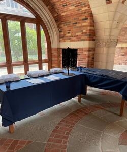 two registration tables with nametags and materials