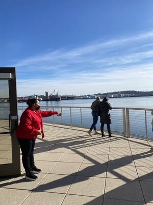 Canal Dock Boathouse tour, person pointing towards water